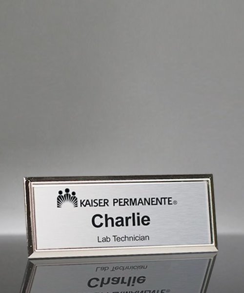 Picture of Imprinted Metal Name Badge With Silver Frame - 3 x 1 Inch